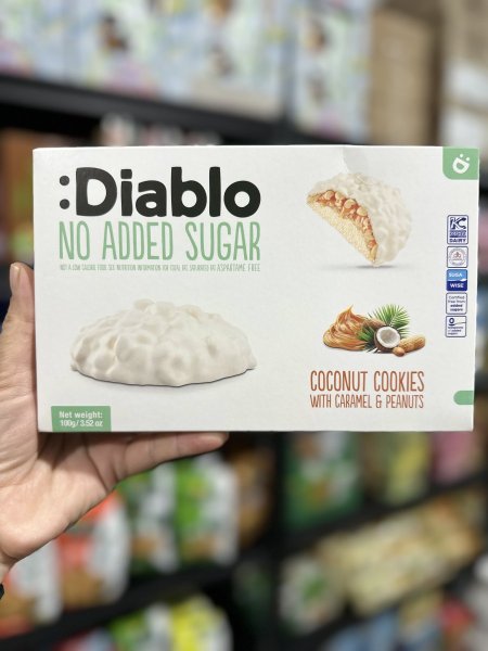 كوكيز ديابلو مغطى بالشوكولاتة البيضاء بحشوة كريمه الفول السوداني وجوز الهند بدون سكر 100غم